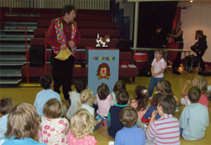 Children watching Truffles the Magician at a party
